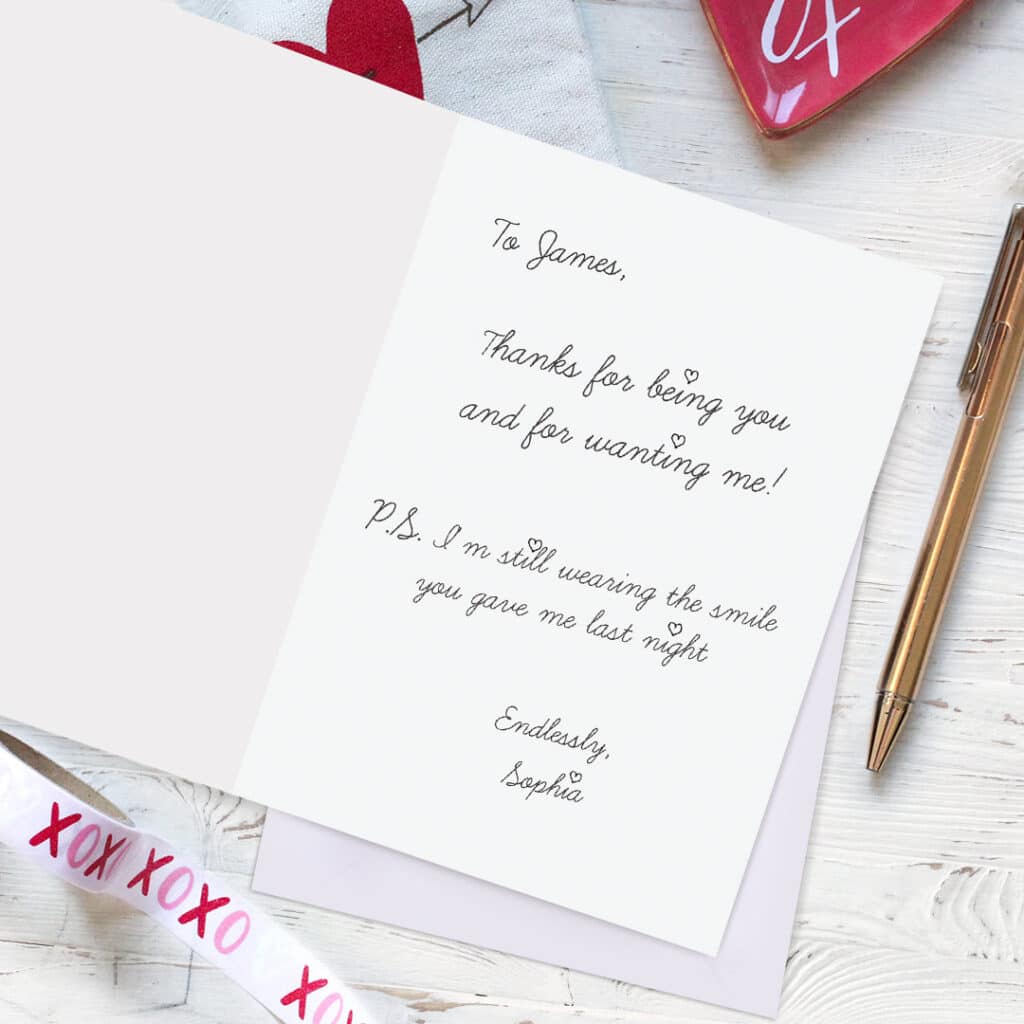 Card with handwritten message lying open on a table