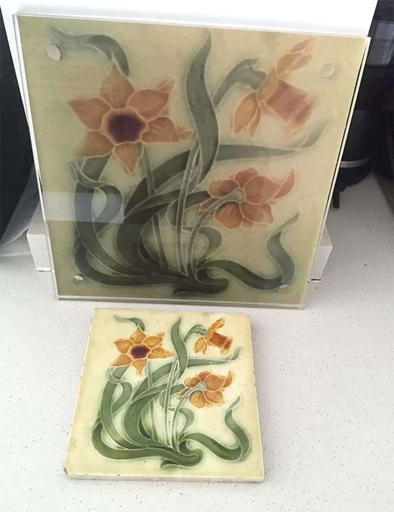 Same floral print on a tile and laminated wall art