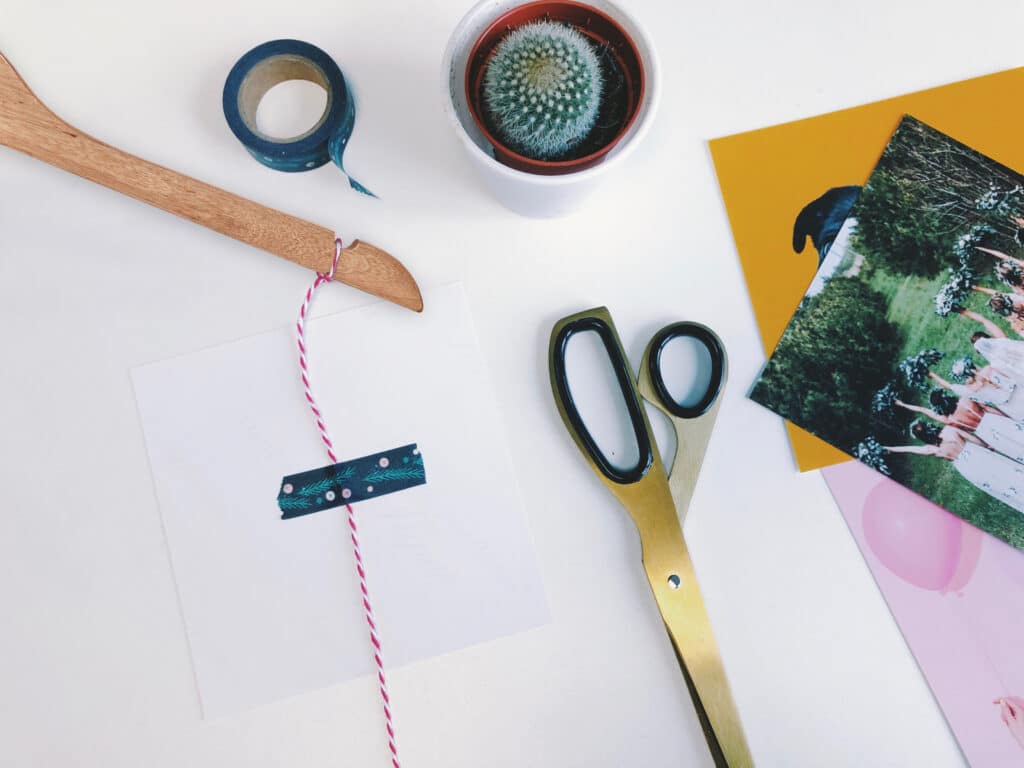 Hanger, string, scissors, plant, tape and prints