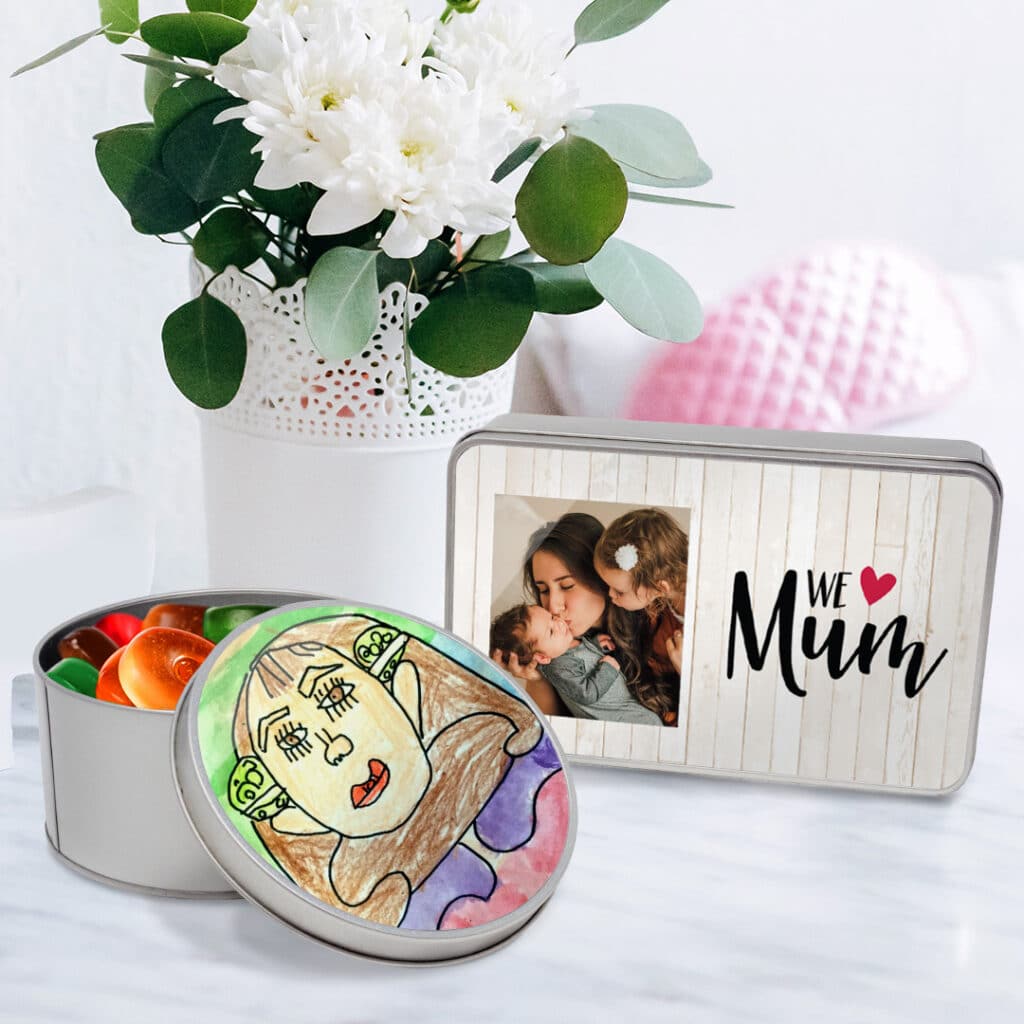 Personalised tins filled with little gifts and sweets