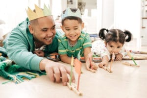 Kids playing with dad