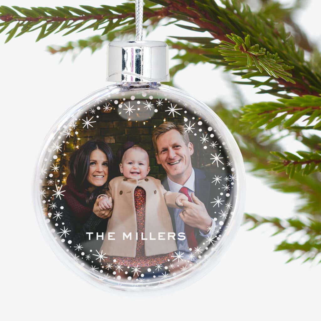 Decorate your tree with photos of loved ones printed onto tree ornaments