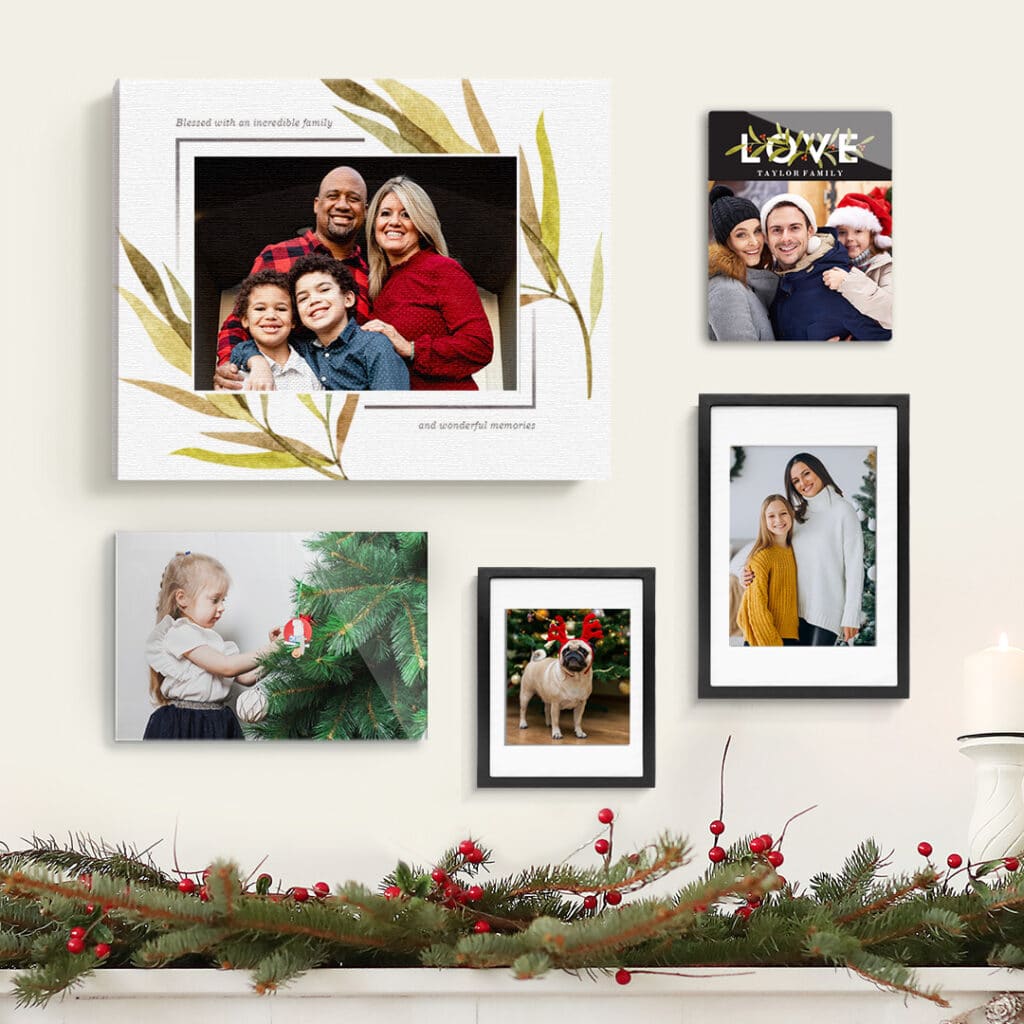 a selection of Christmas wall art placed above a fire place