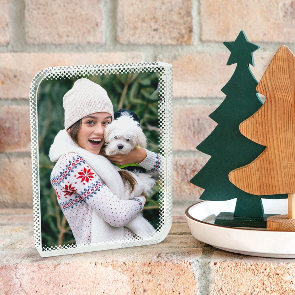 an glass photo block with an image of a lovely girl with her dog
