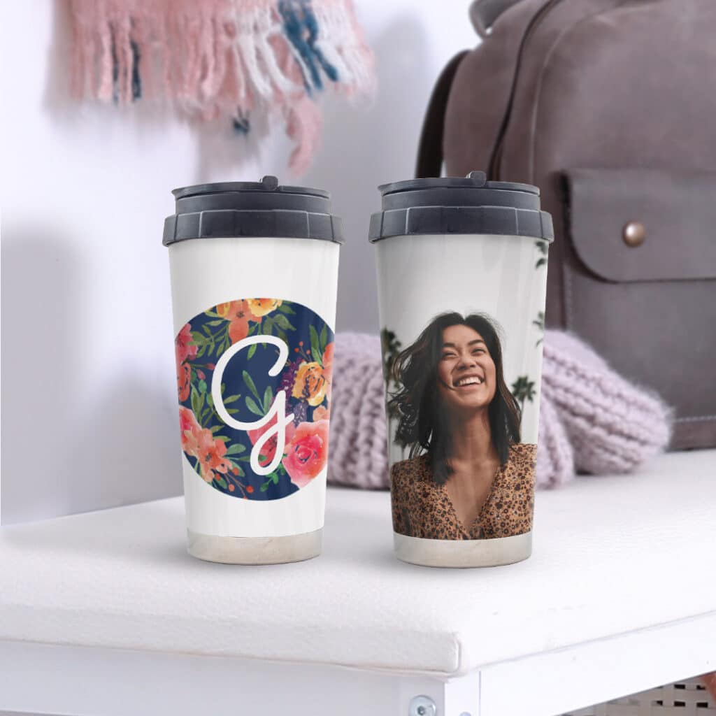 two travel mugs printed with photos on shelf