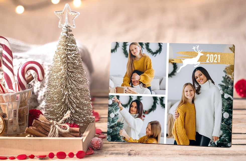 a metal tabletop panel with lovely photos of a mother and a daughter decorating a Christmas tree