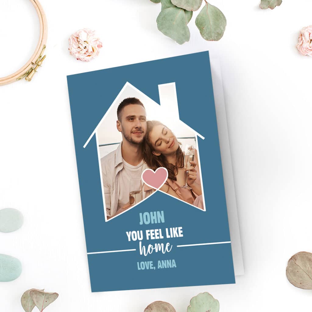 A lovely, light blue 'You feel like home' Valentine's day card design with a photo of a couple in love