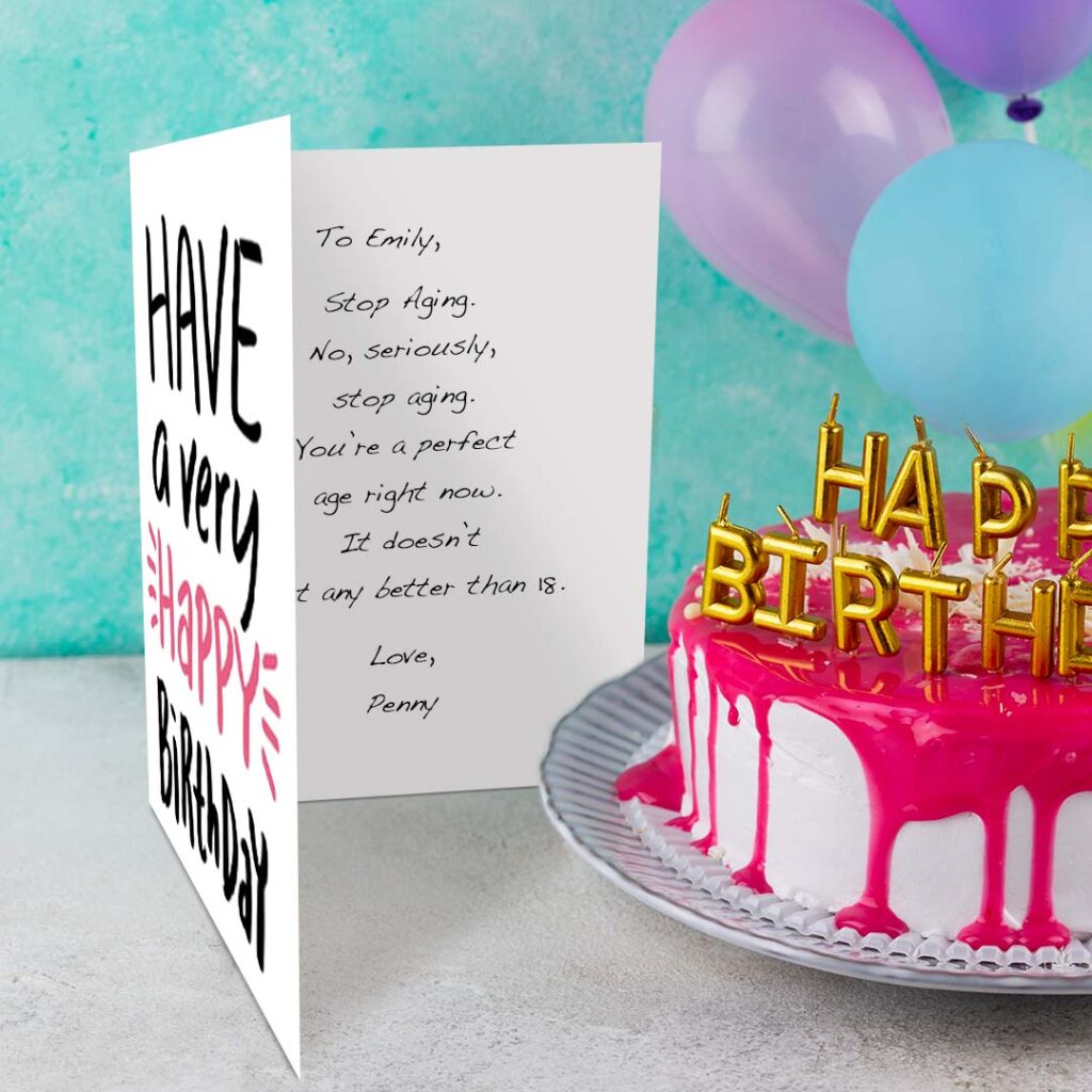 open birthday card next to cake