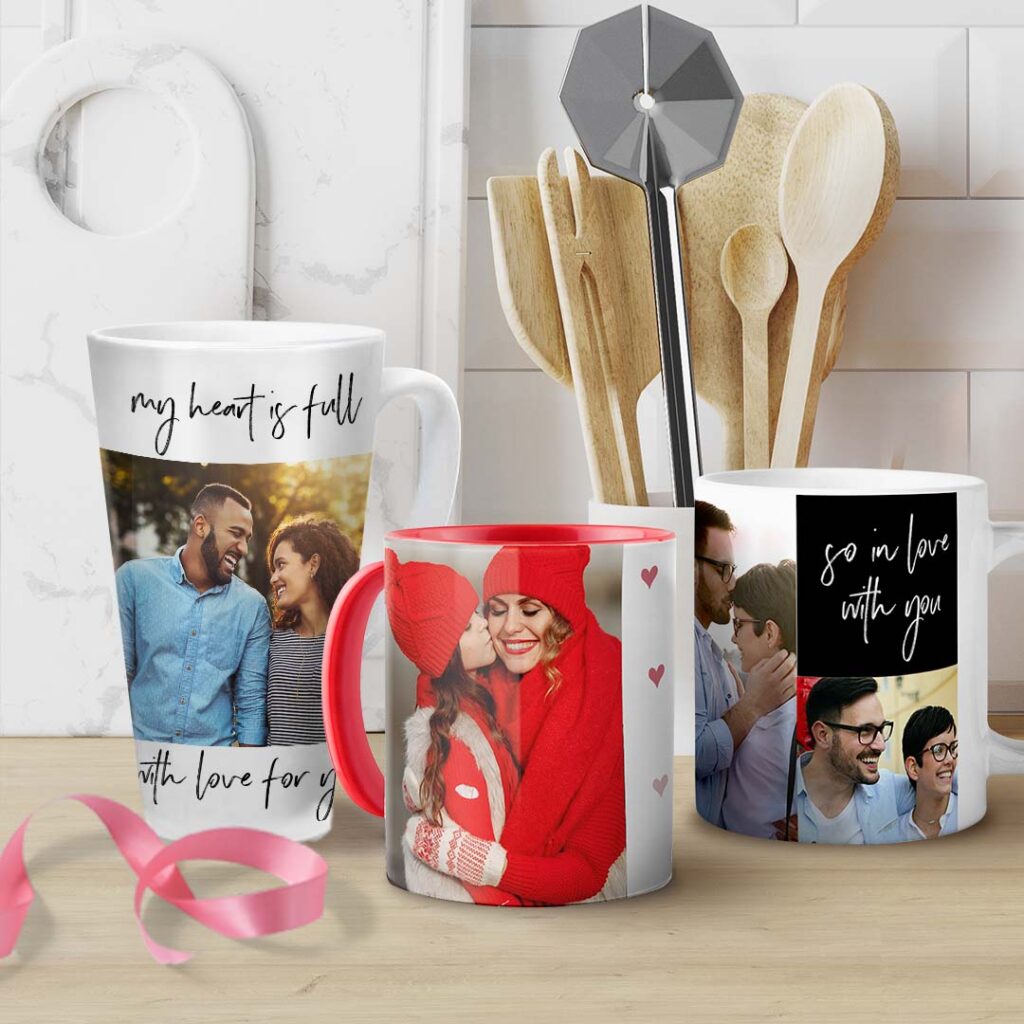 Range of 11oz white, latte, and red coloured mug on counter top, printed with Valentines Designs