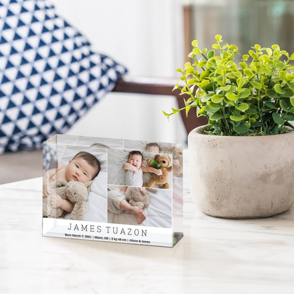 acrylic photo block next to a concrete plant pot