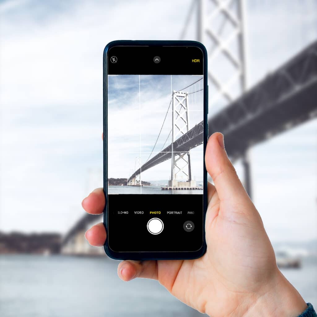Person taking photo of a bridge with their phone