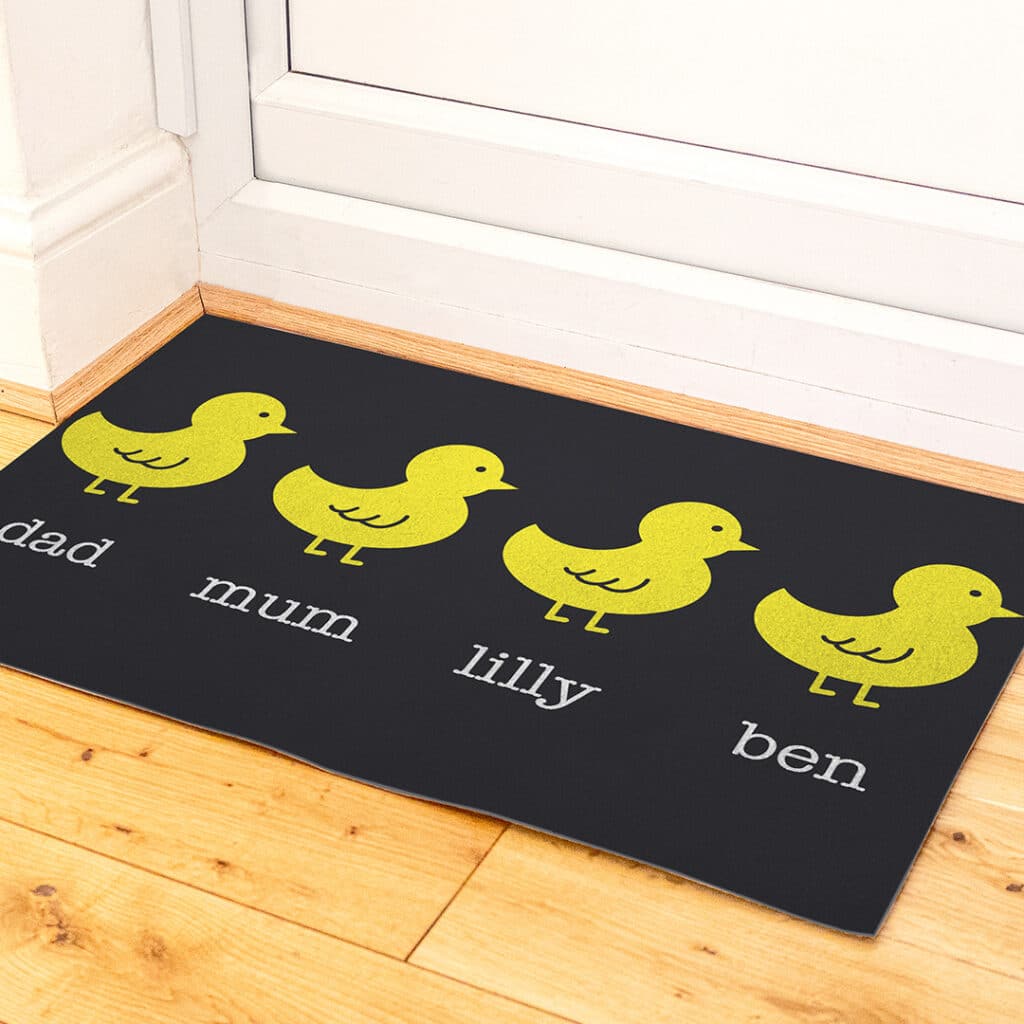 Chick family printed door mat in front of a doorway