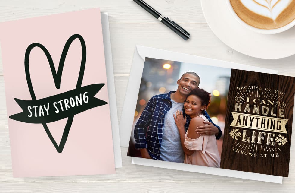 A pair of Greeting Cards on a wooden table