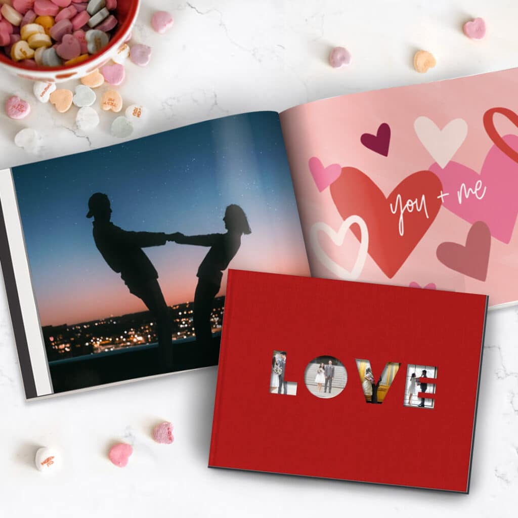 Photobooks with heart sweets on a table