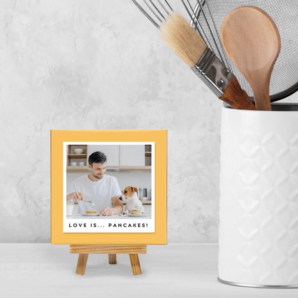 A Ceramic Tile With Stand next to a utensil holder