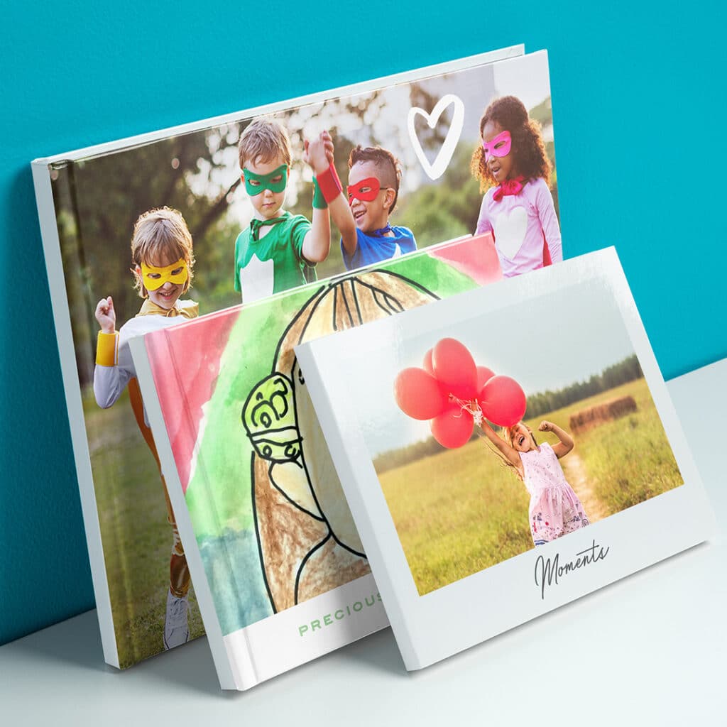 A stack of photobooks leaning up against one another