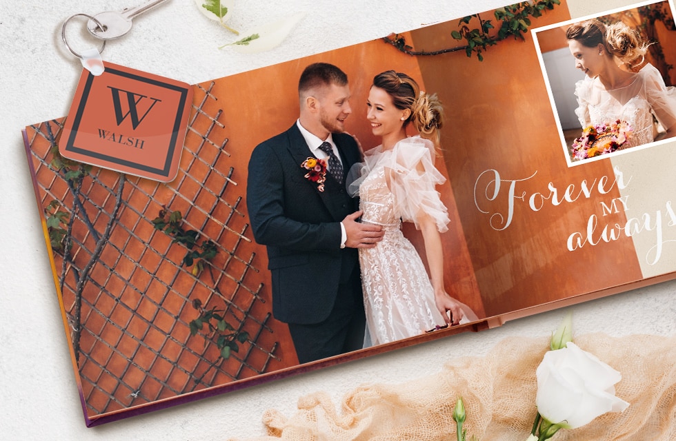 An open photo book of a wedding couple